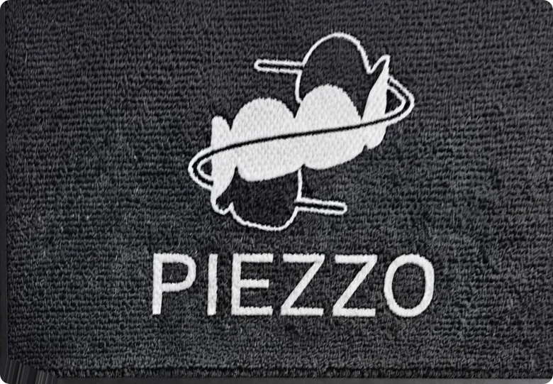 Tapete de alfombra tipo panal con logotipo impreso, visto desde arriba